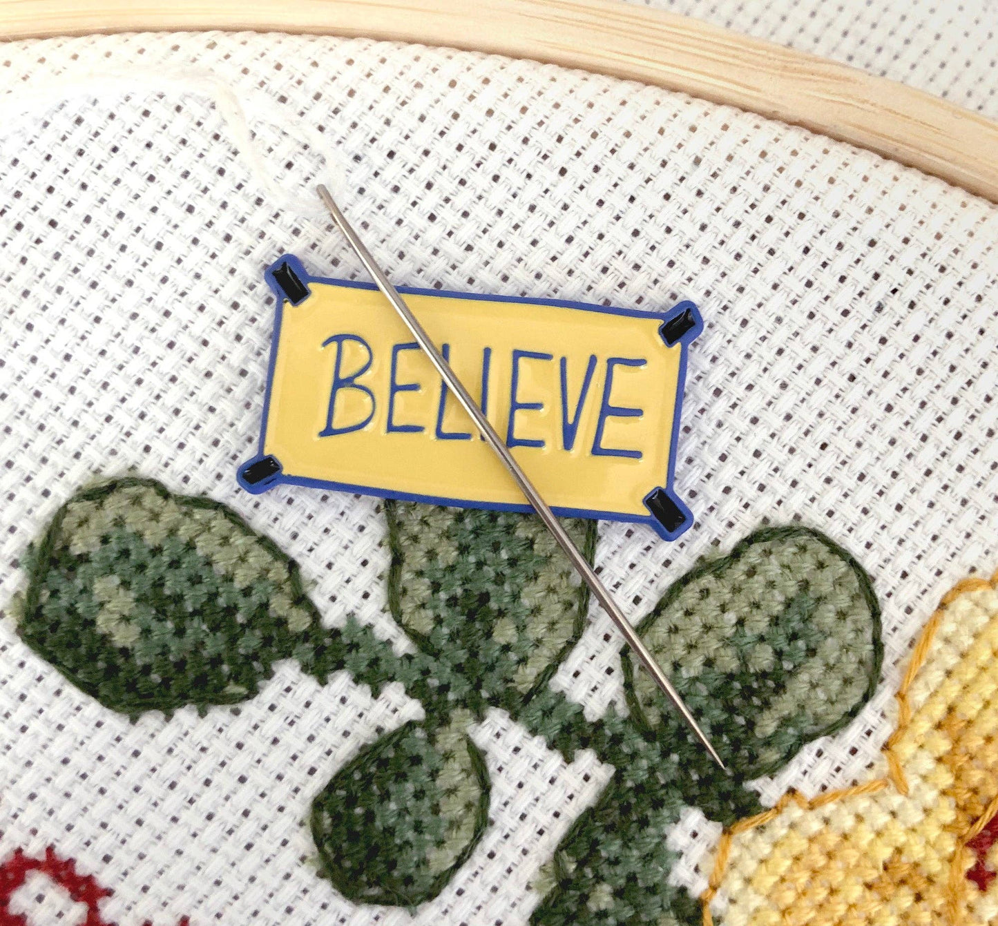 "Believe" Poster Needle Minder